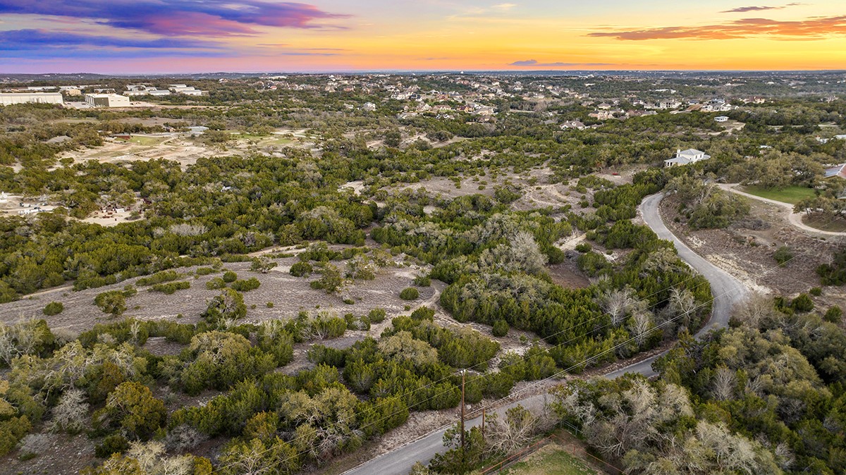 411 Whitetail Ridge Dripping Springs, TX 78620 - Photo 3 of 40 a view of a city with mountains in the background