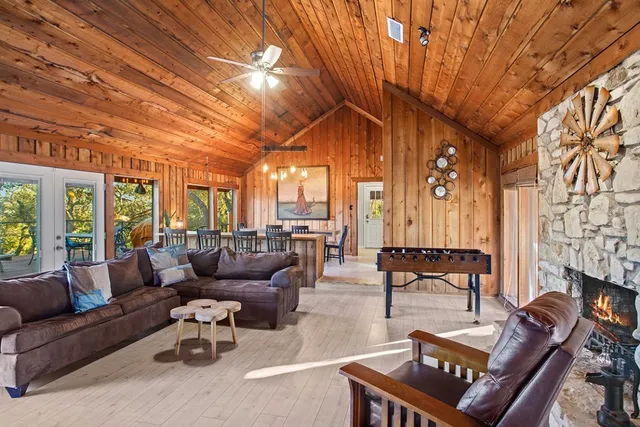 a view of a dining room with furniture large windows and wooden floor