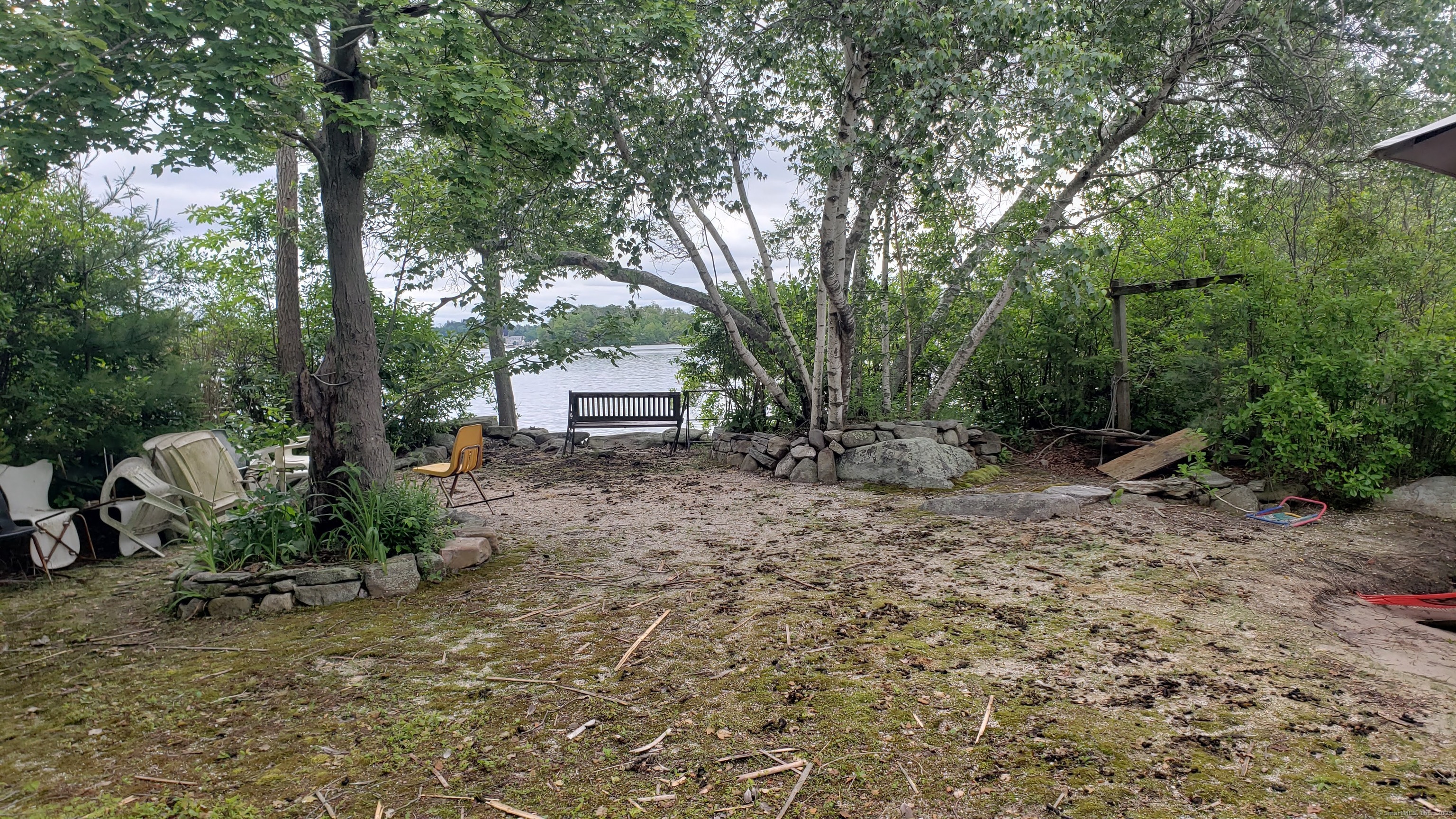 Island East Hampton, CT 06424 - Photo 9 of 12 a backyard of a house with seating space