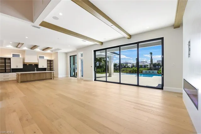 a view of an empty room with a balcony