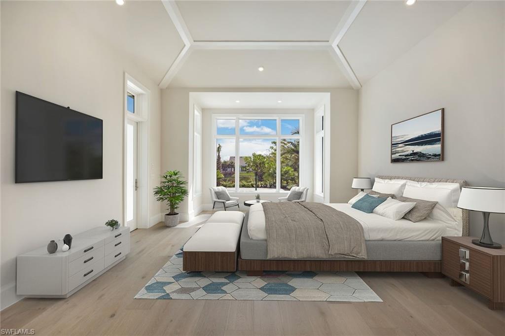 16728 Enclave Circle Naples, FL 34110 - Photo 17 of 50 a spacious bedroom with a large bed and a flat screen tv