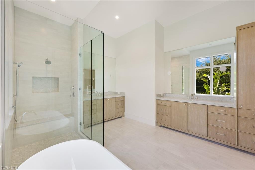 16728 Enclave Circle Naples, FL 34110 - Photo 21 of 50 a bathroom with a sink toilet and shower