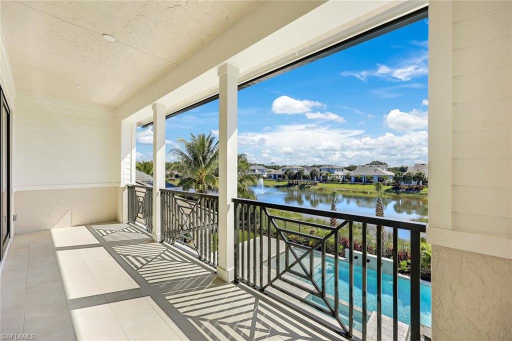 16728 Enclave Circle Naples, FL 34110 - Photo 32 of 50 a view of a balcony with wooden floor