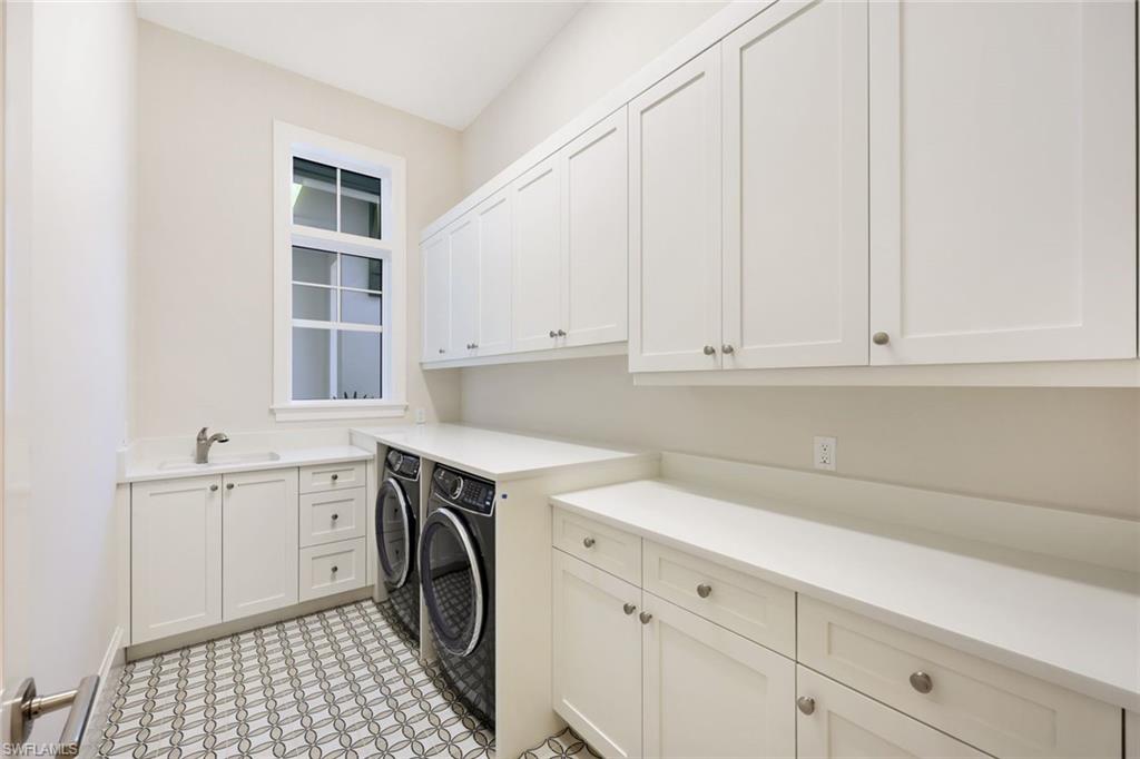 16728 Enclave Circle Naples, FL 34110 - Photo 35 of 50 a utility room with sink dryer and washer