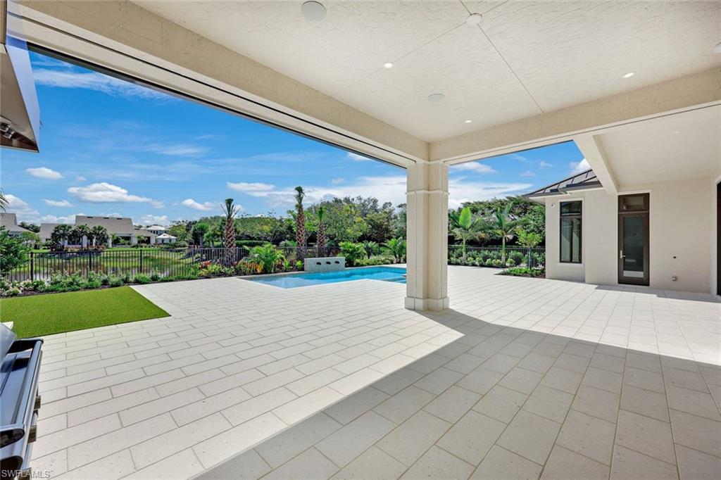 16728 Enclave Circle Naples, FL 34110 - Photo 41 of 50 a view of house with yard and outdoor space