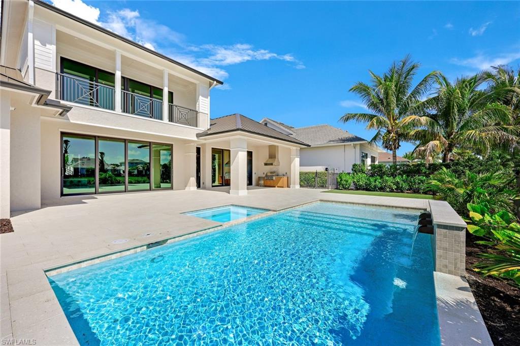 16728 Enclave Circle Naples, FL 34110 - Photo 45 of 50 a front view of a house with a yard