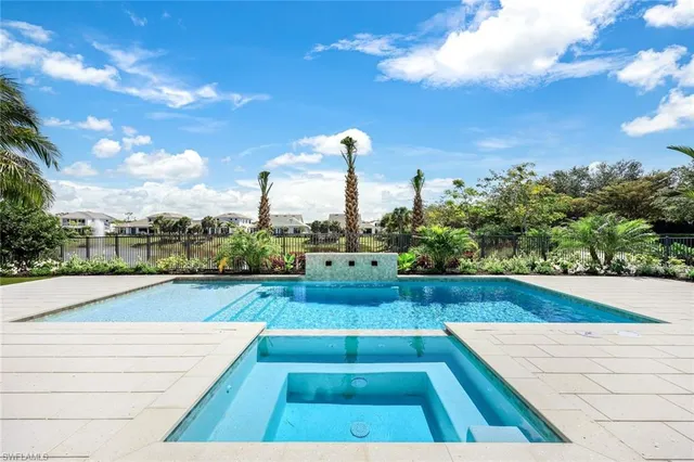 an aerial view of a house with a lake view