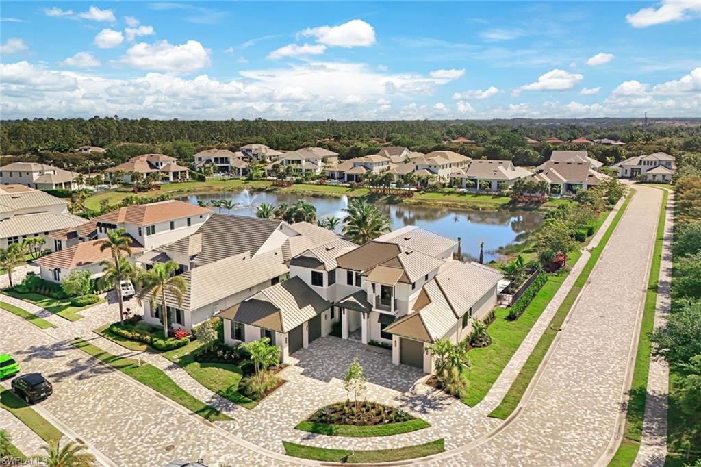 16728 Enclave Circle Naples, FL 34110 - Photo 48 of 50 an aerial view of a house with a lake view
