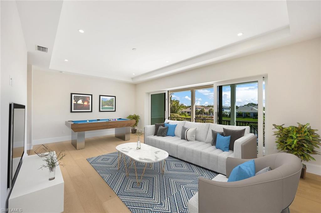 16728 Enclave Circle Naples, FL 34110 - Photo 5 of 50 a living room with furniture and a large window