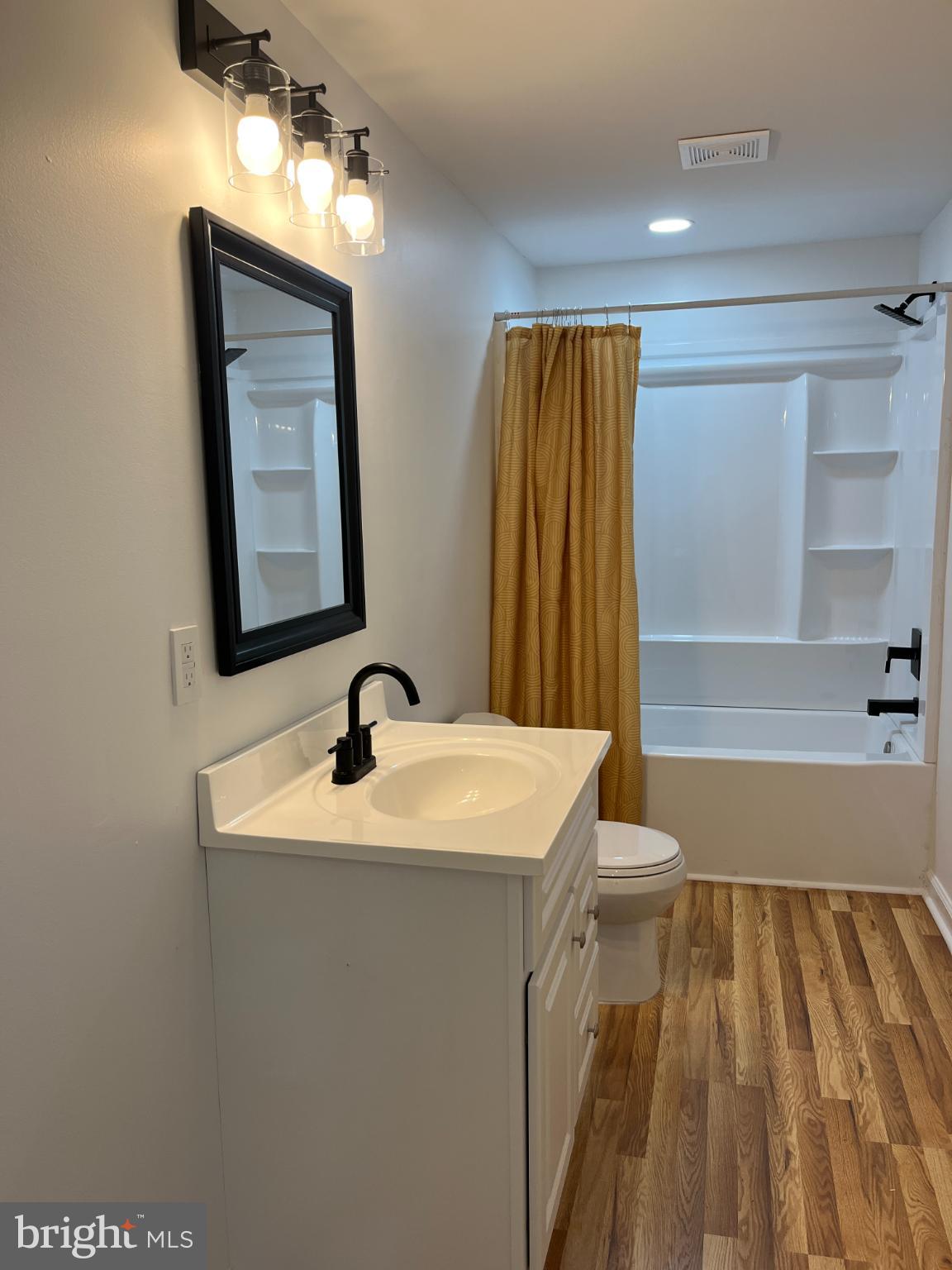 7060 Fredericks Hall Road Mineral, VA 23117 - Photo 14 of 16 a bathroom with a sink a toilet and shower