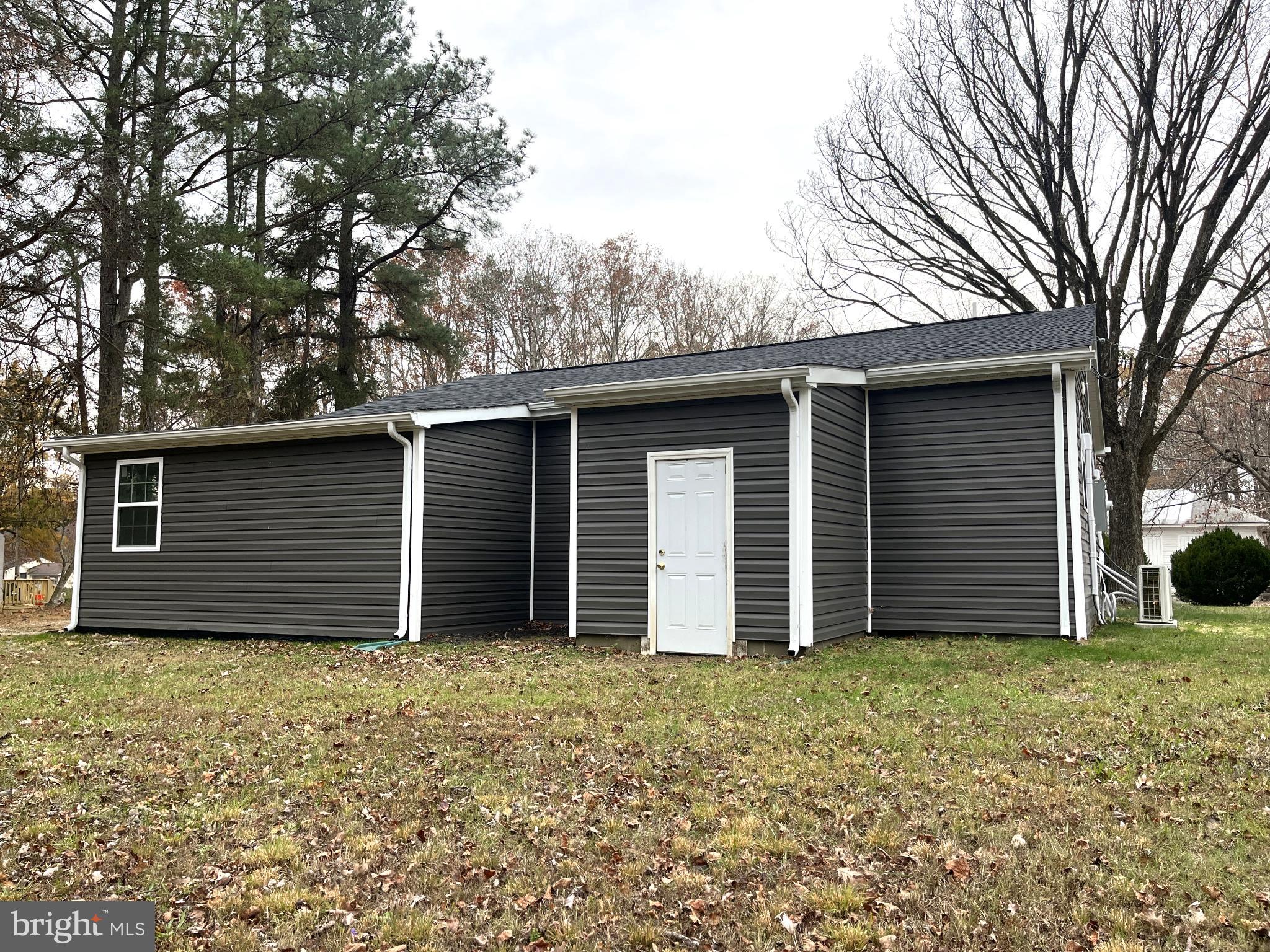 7060 Fredericks Hall Road Mineral, VA 23117 - Photo 16 of 16 a house with a backyard