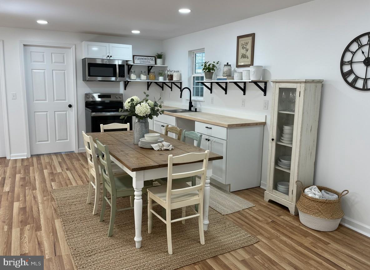 7060 Fredericks Hall Road Mineral, VA 23117 - Photo 2 of 16 a kitchen with a table and chairs