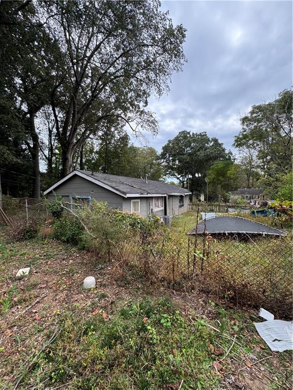 a backyard of a house with lots of green space