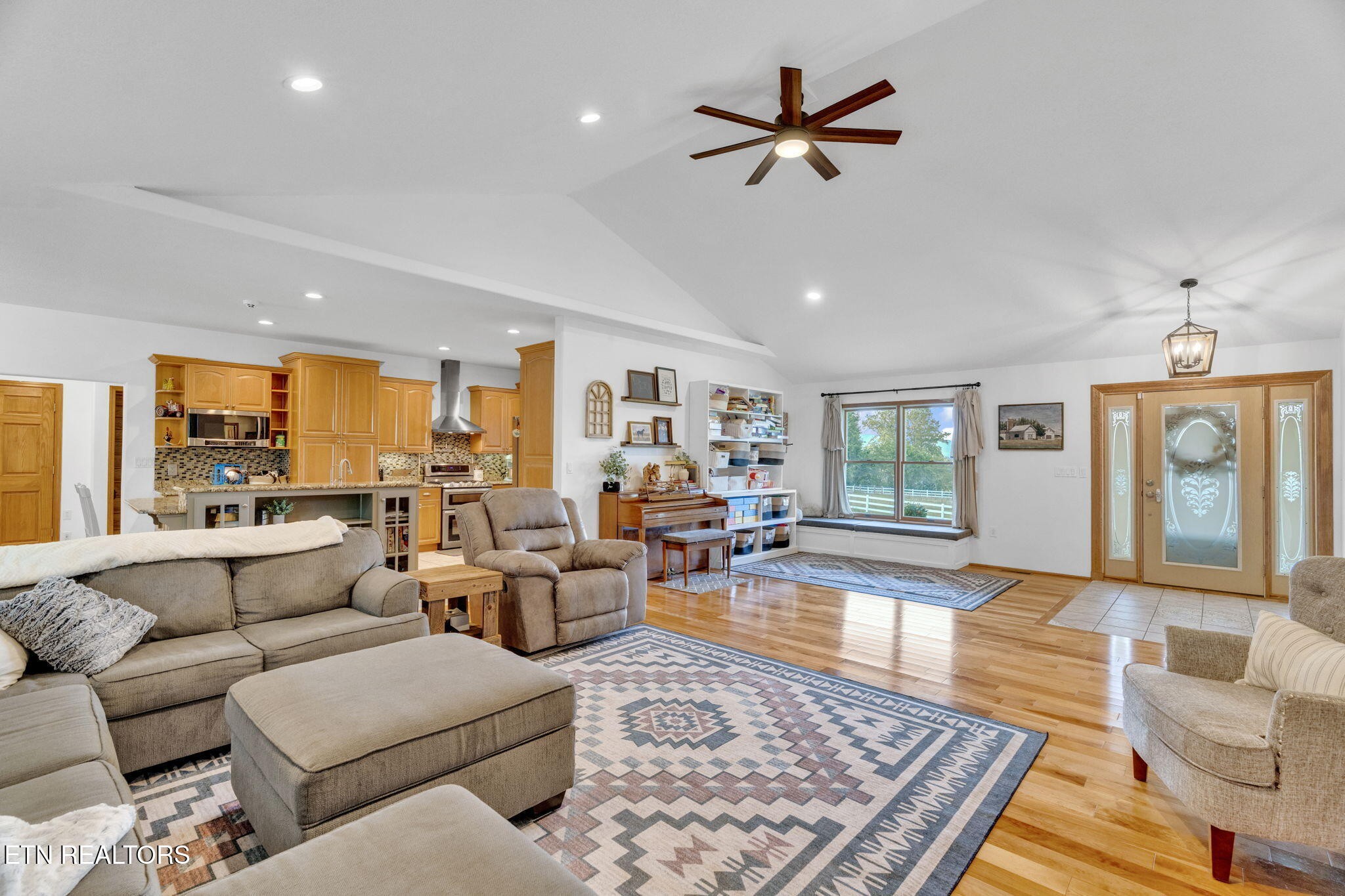 596 Clifty Creek Road Oakdale, TN 37829 - Photo 11 of 60 a living room with furniture ceiling fan and a rug