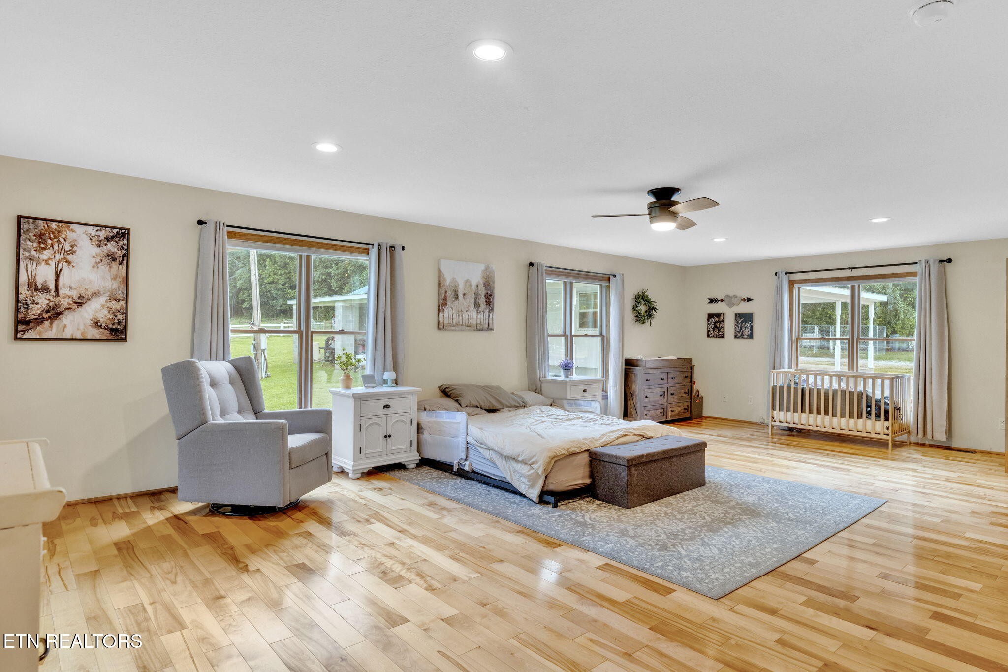 596 Clifty Creek Road Oakdale, TN 37829 - Photo 16 of 60 a bedroom with a bed and glass window