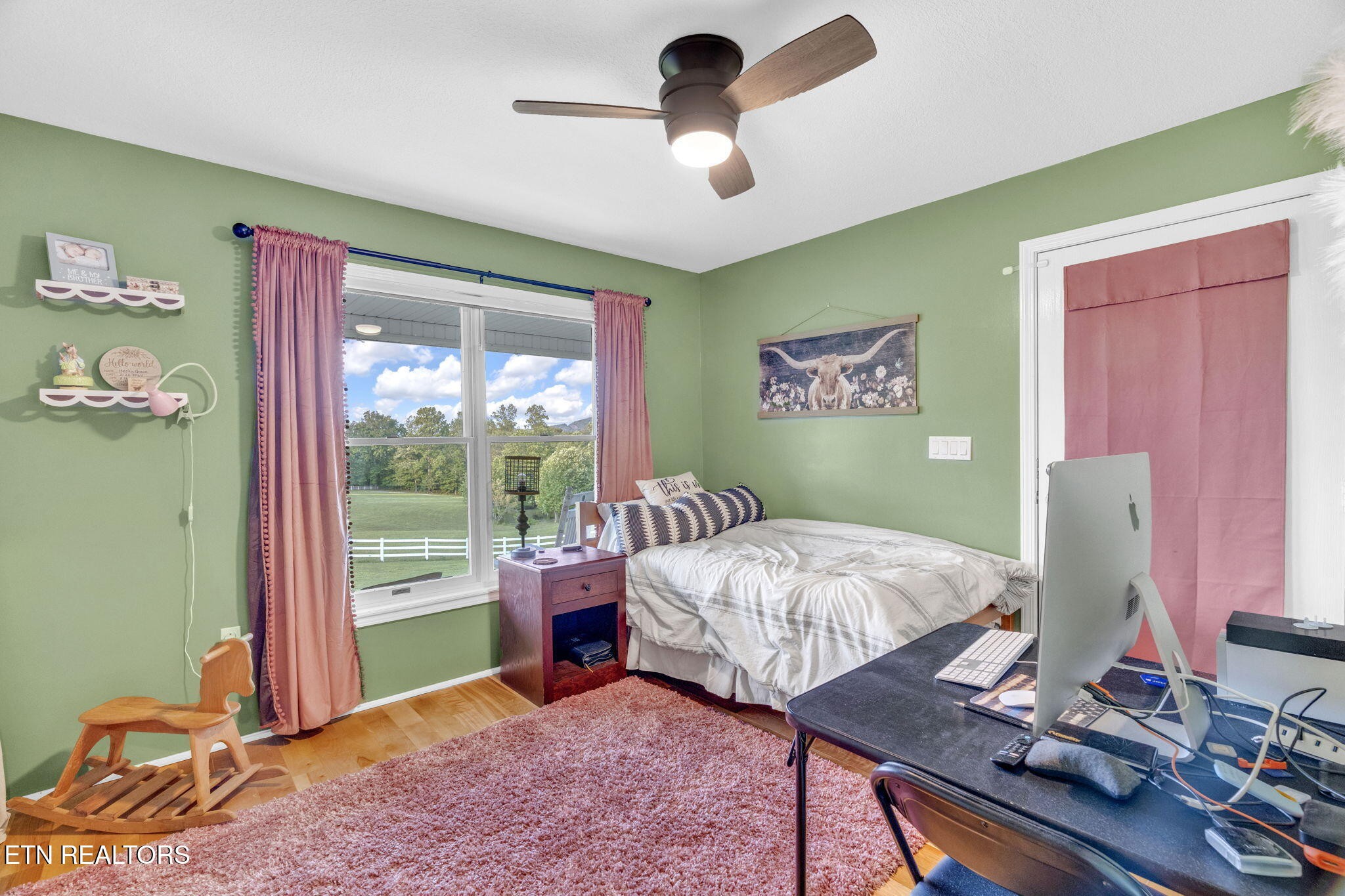 596 Clifty Creek Road Oakdale, TN 37829 - Photo 24 of 60 a bedroom with a bed and a desk