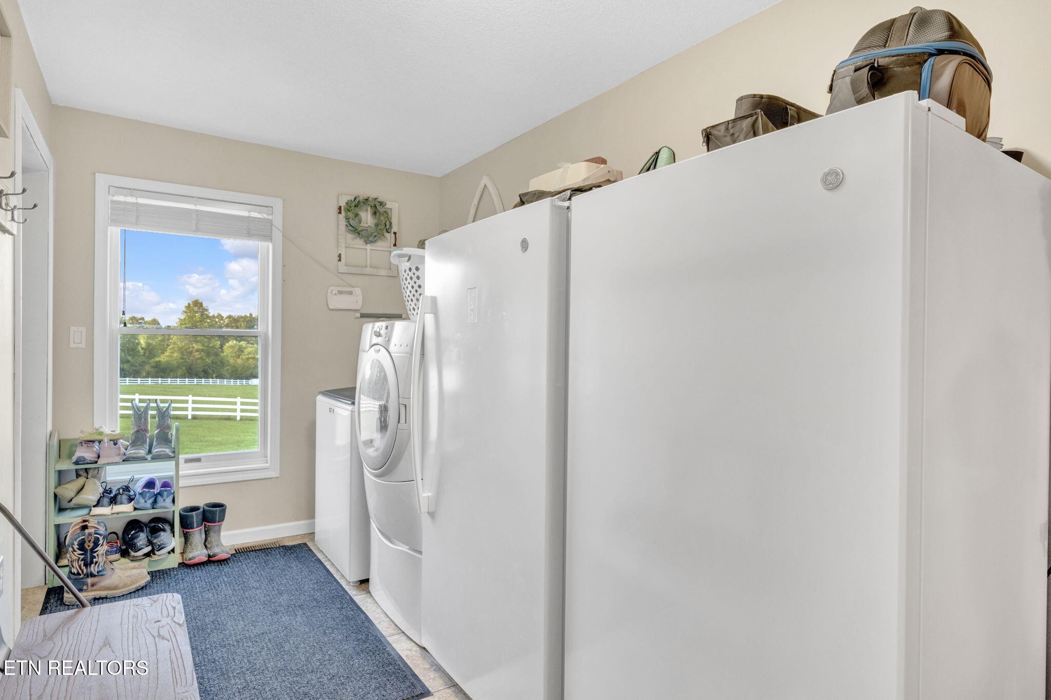 596 Clifty Creek Road Oakdale, TN 37829 - Photo 27 of 60 a white refrigerator freezer sitting in a kitchen