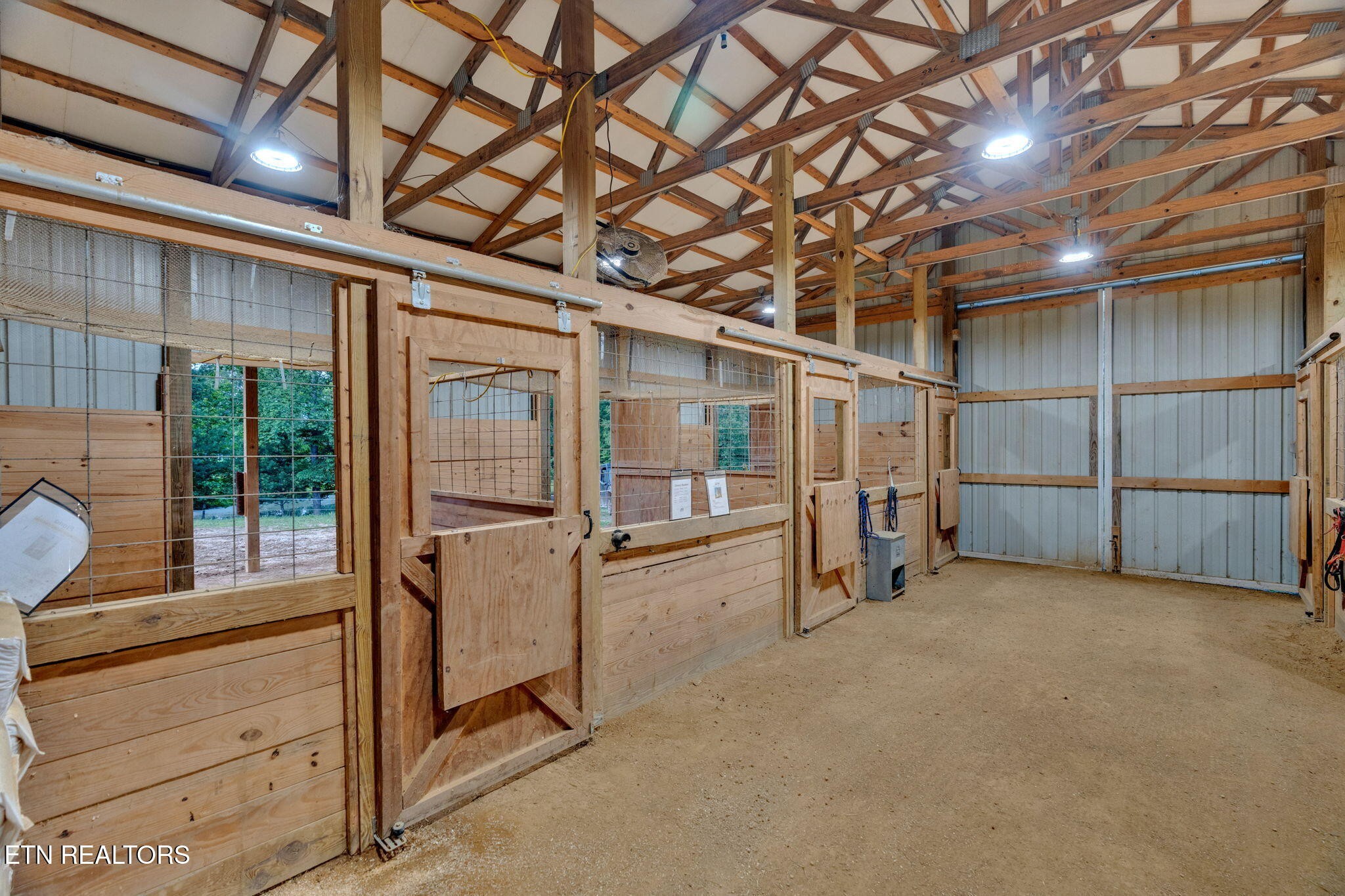 596 Clifty Creek Road Oakdale, TN 37829 - Photo 30 of 60 a view of an empty room with wooden floor and a window