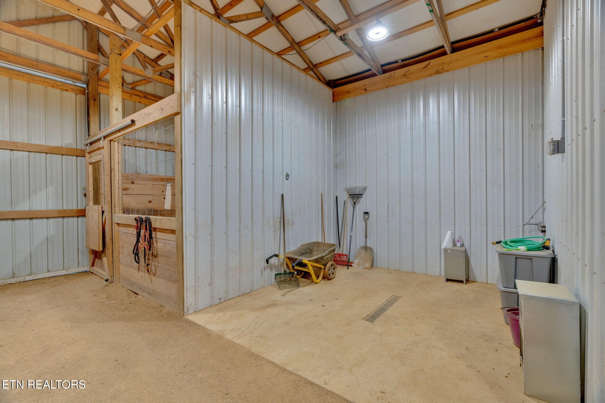 596 Clifty Creek Road Oakdale, TN 37829 - Photo 32 of 60 a bed room with a bed and a chair