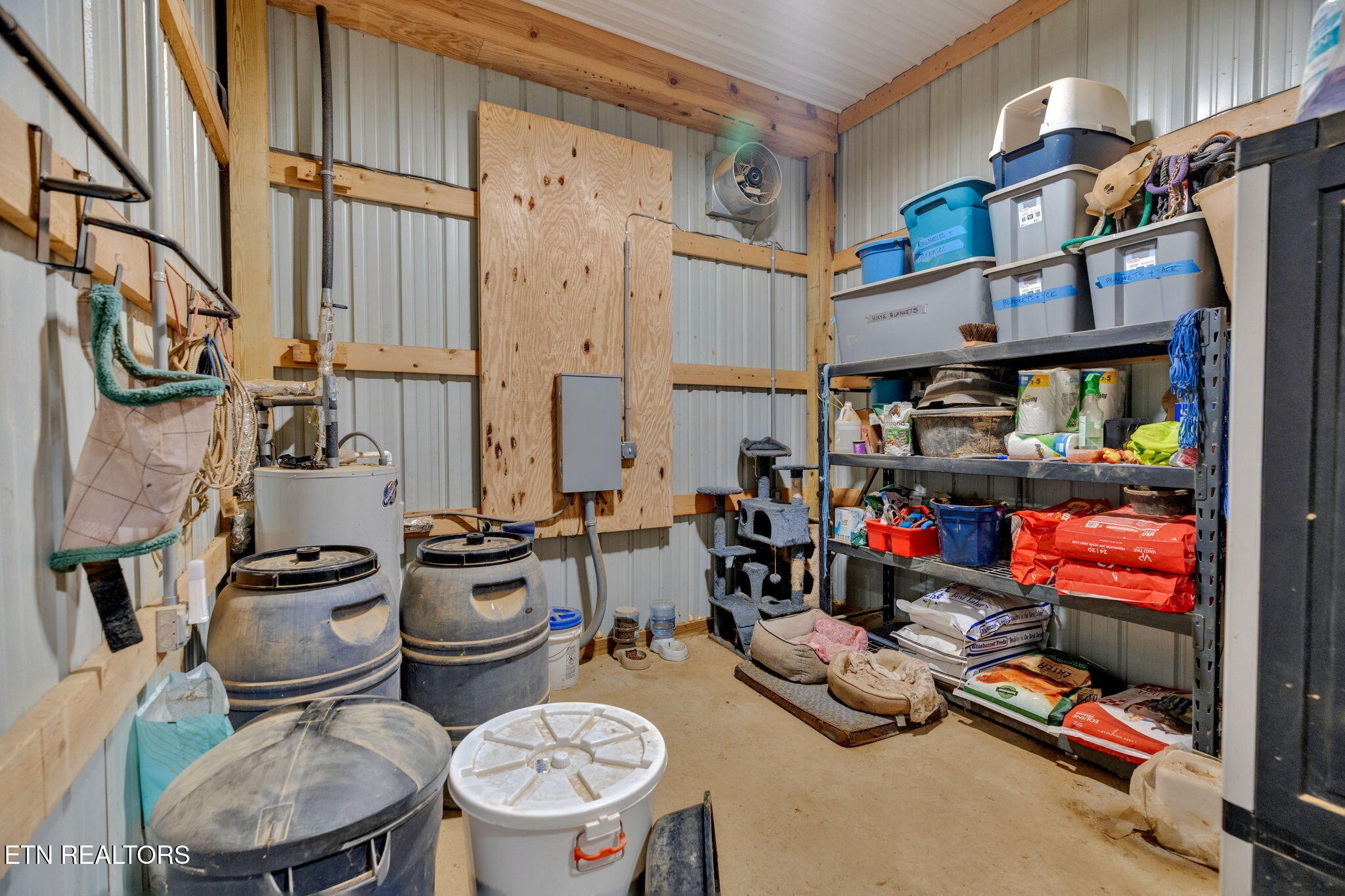 596 Clifty Creek Road Oakdale, TN 37829 - Photo 33 of 60 a storage room with lots of clutter and chairs