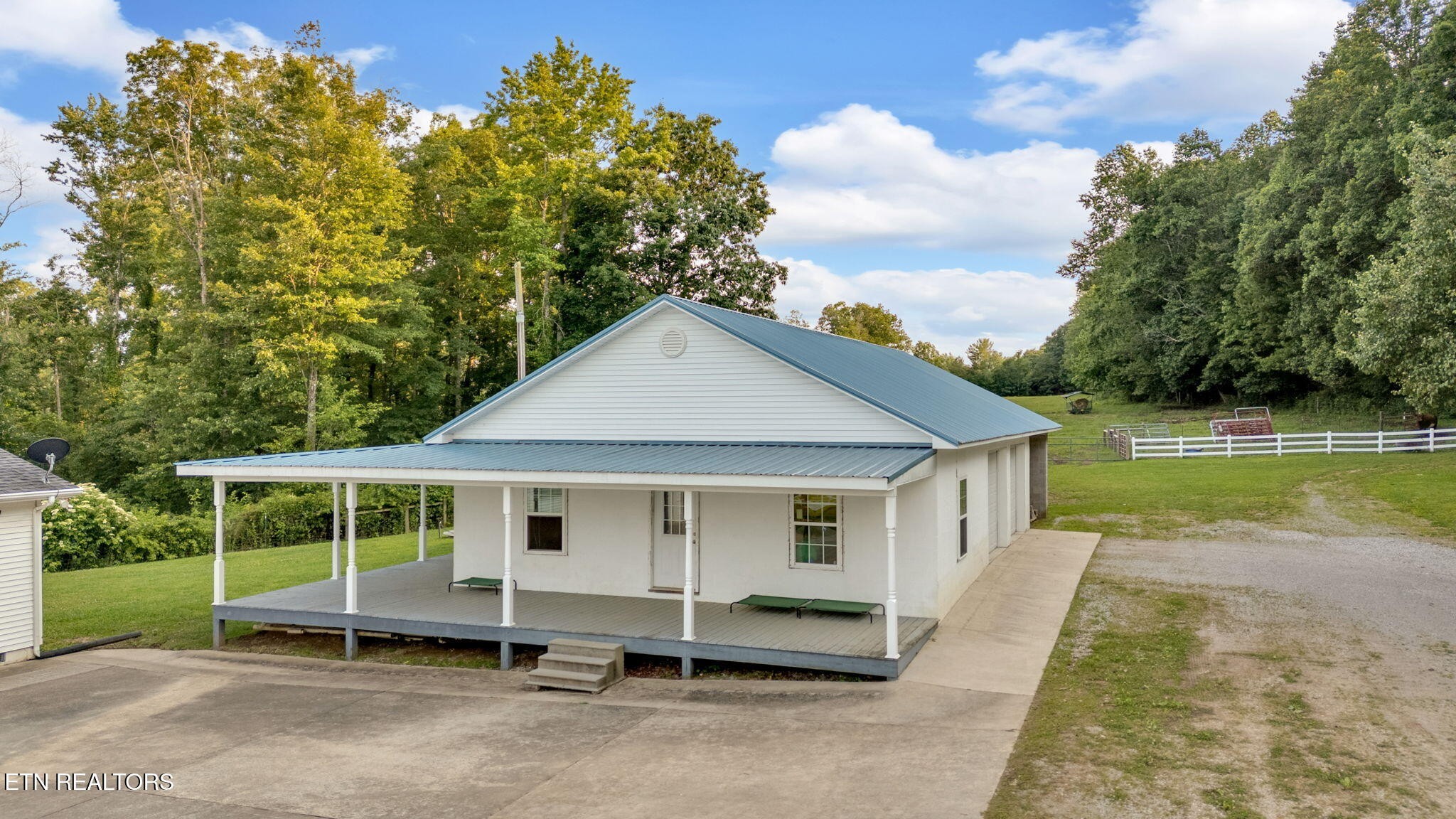 596 Clifty Creek Road Oakdale, TN 37829 - Photo 34 of 60 a view of a house with a yard