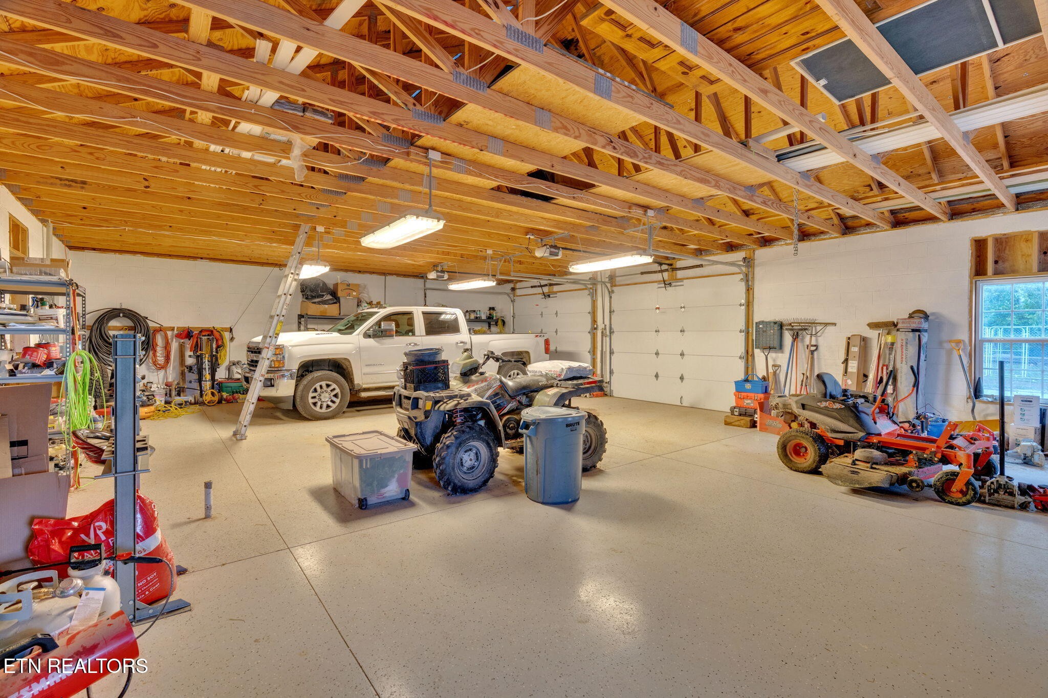 596 Clifty Creek Road Oakdale, TN 37829 - Photo 35 of 60 a view of a garage with parked cars