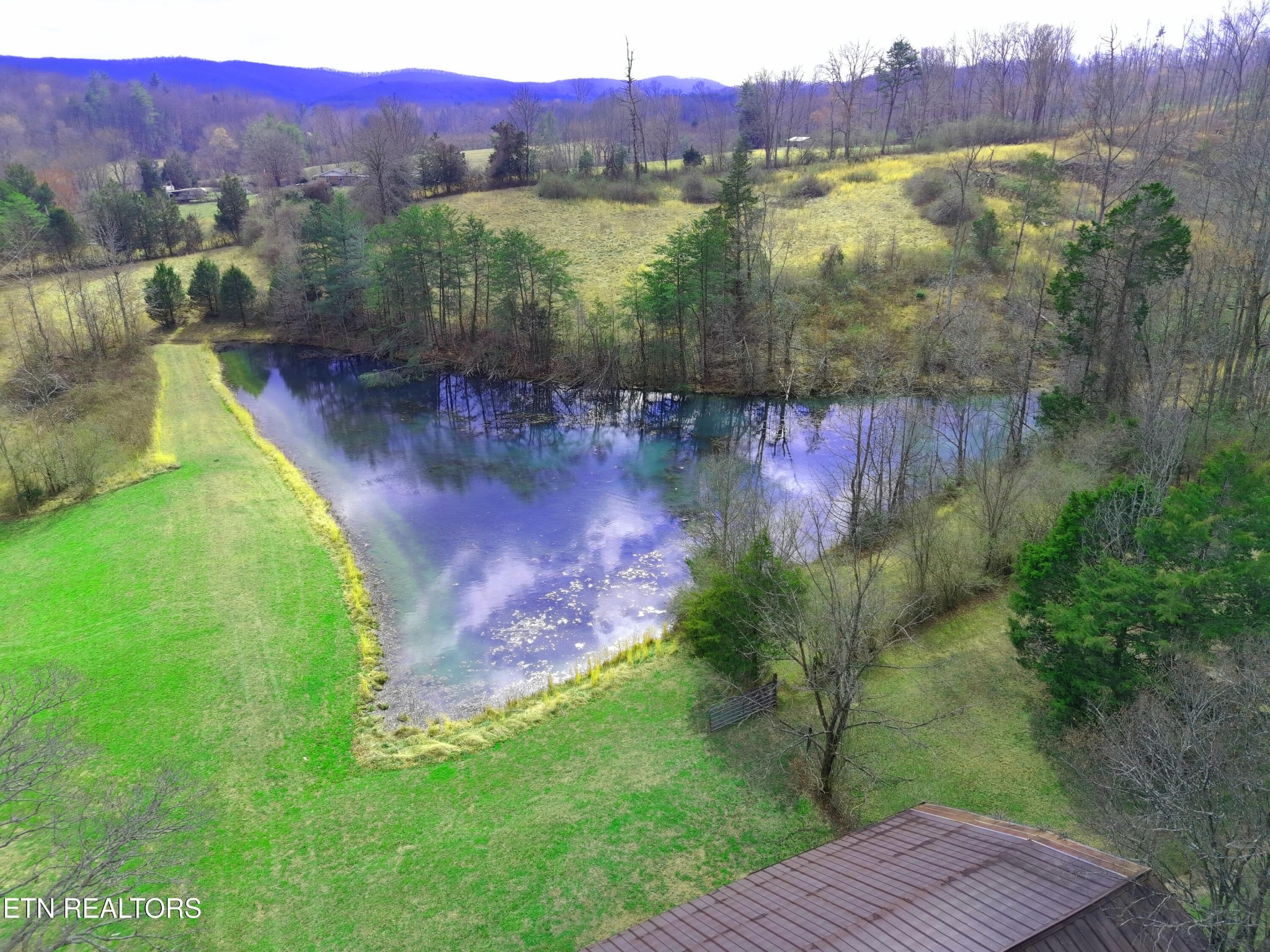 596 Clifty Creek Road Oakdale, TN 37829 - Photo 5 of 60 a view of a lake with a mountain in the background