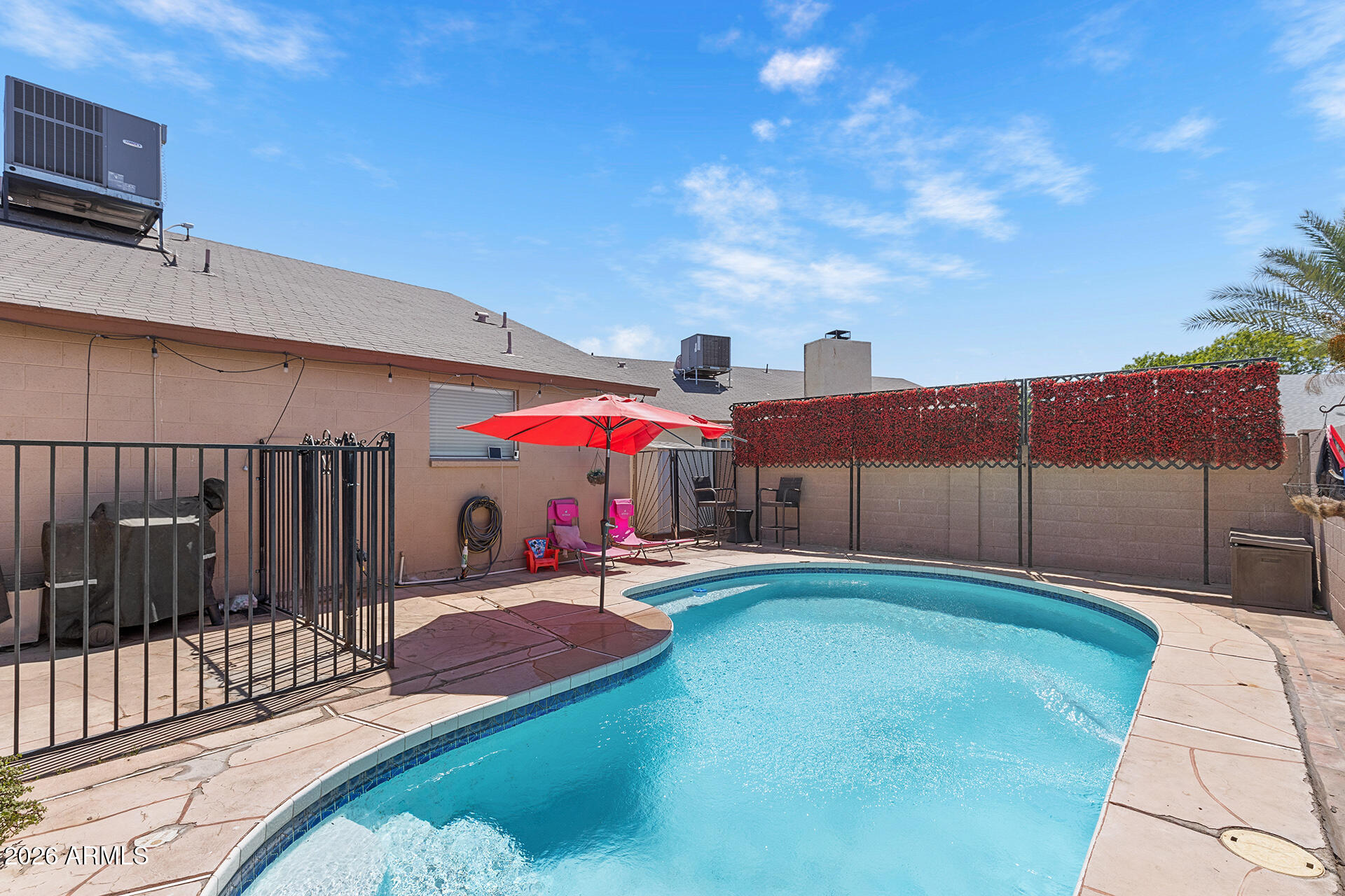 9002 West Coronado Road Phoenix, AZ 85037 - Photo 52 of 54 a view of a backyard with a patio