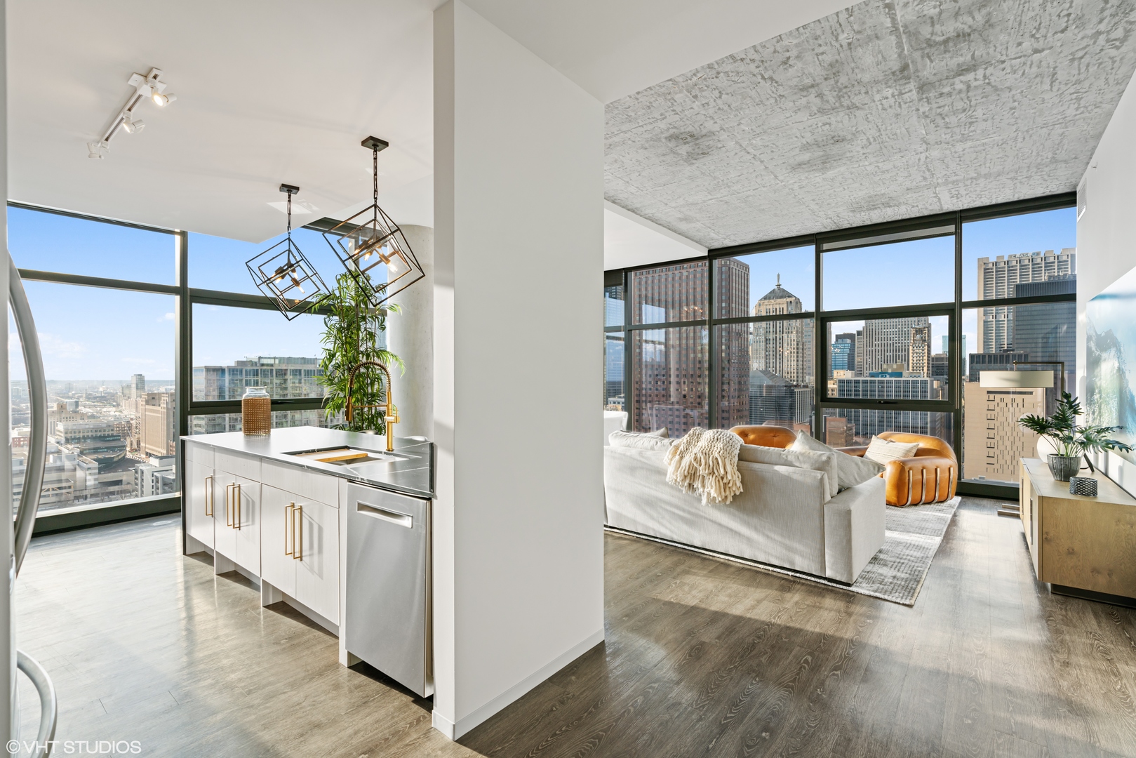 717 South Clark Street, Unit 3003 Chicago, IL 60605 - Photo 7 of 15 a living room with furniture and a chandelier