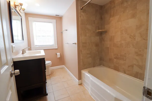 a bathroom with a bathtub and a sink