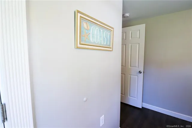 a view of an empty room with closet
