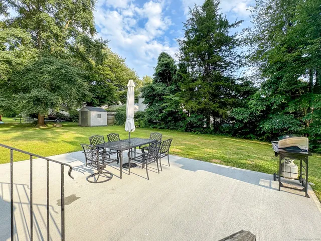 a view of a swimming pool with an outdoor space and seating area