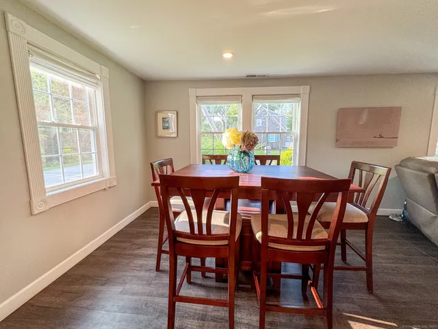 a view of a dining room with furniture window and outside view