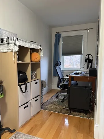 a bathroom with a sink a toilet and a shower curtain