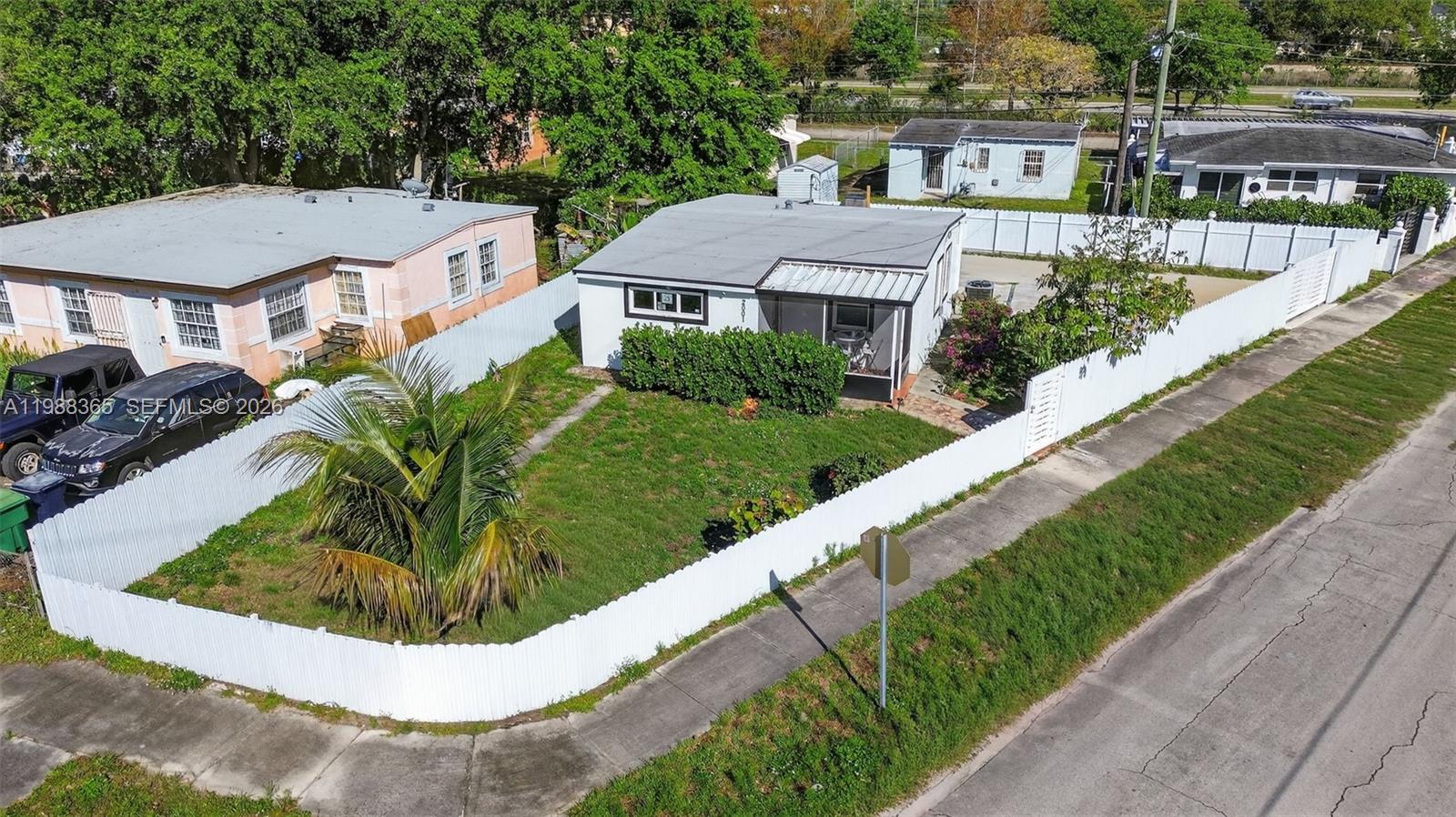 a view of a house with a swimming pool and a yard