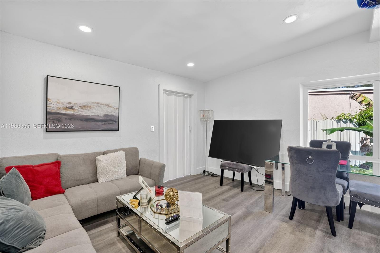 2001 Rutland Street Opa-Locka, FL 33054 - Photo 11 of 29 a living room with furniture and a flat screen tv