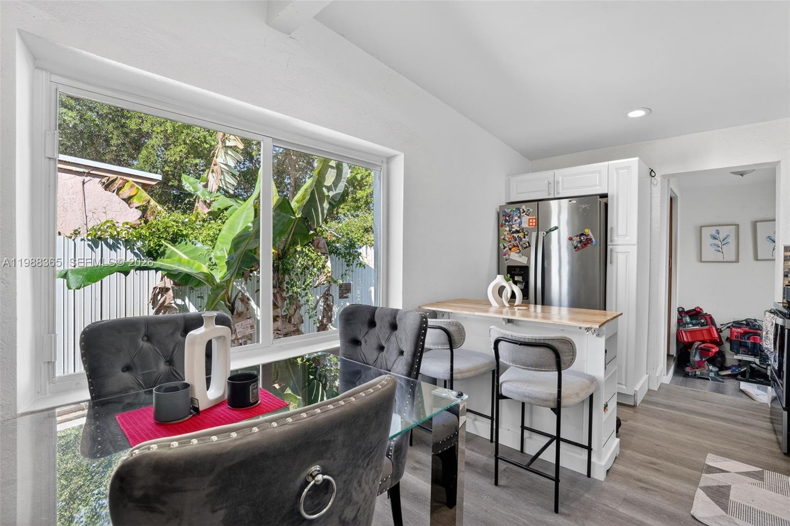 2001 Rutland Street Opa-Locka, FL 33054 - Photo 12 of 29 a living room with furniture and a floor to ceiling window