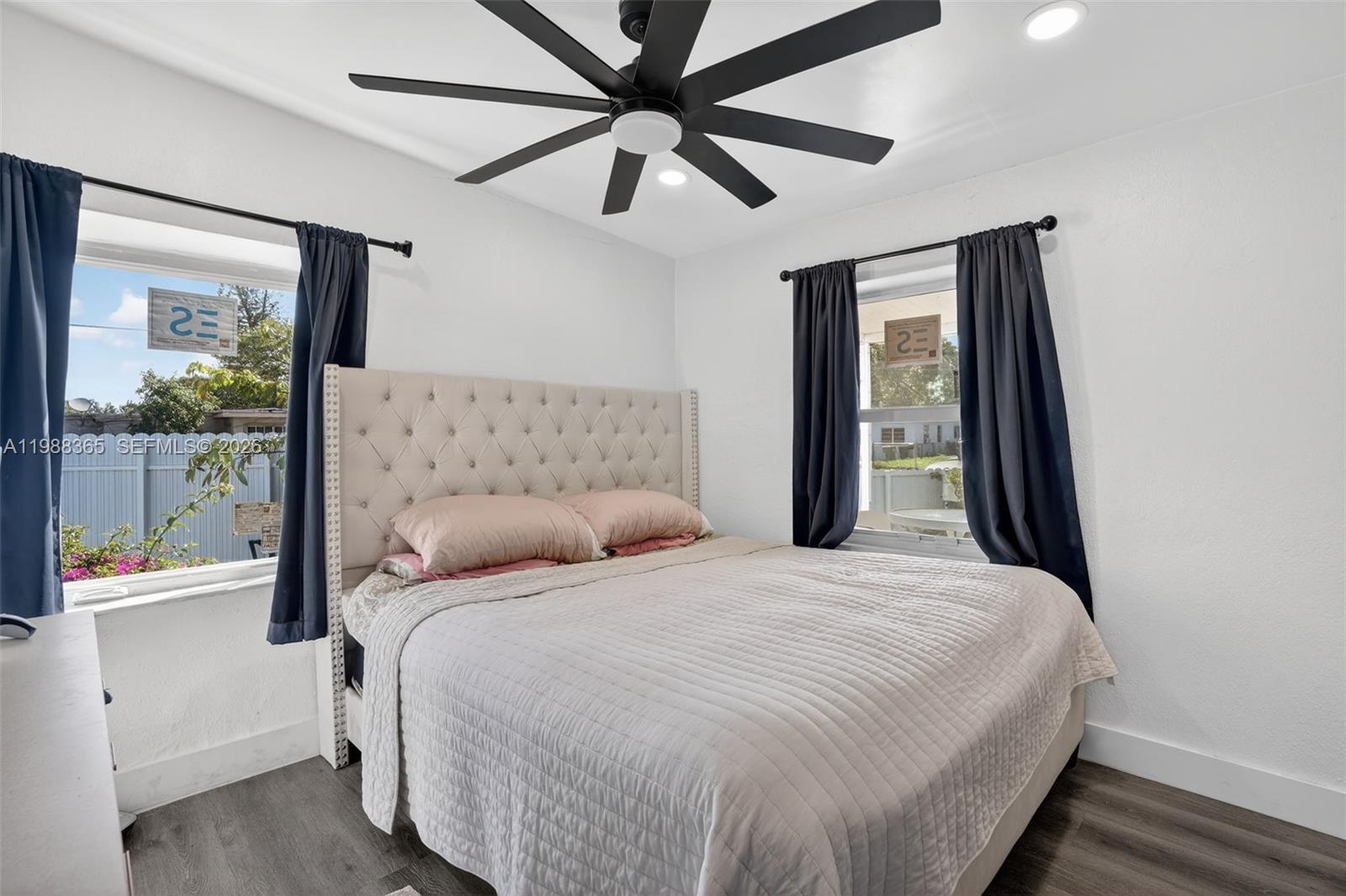 2001 Rutland Street Opa-Locka, FL 33054 - Photo 16 of 29 a bedroom with a bed and a large mirror