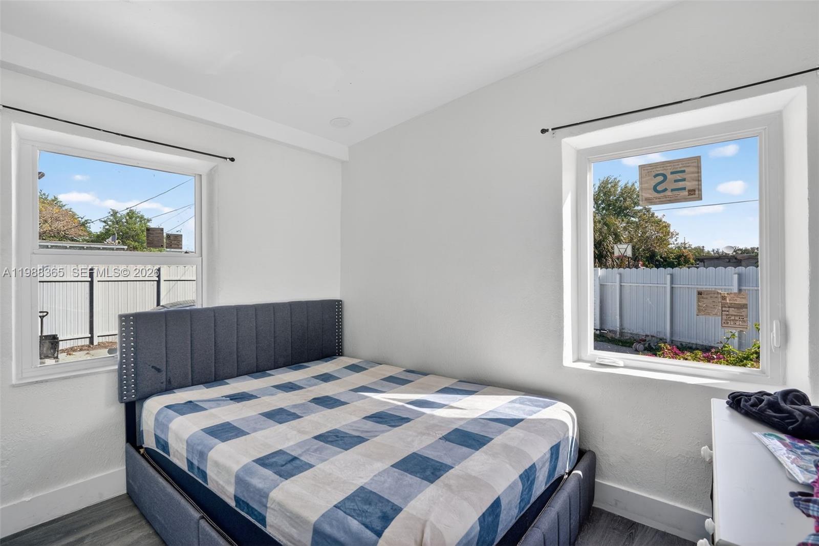 2001 Rutland Street Opa-Locka, FL 33054 - Photo 18 of 29 a bedroom with a bed and a window