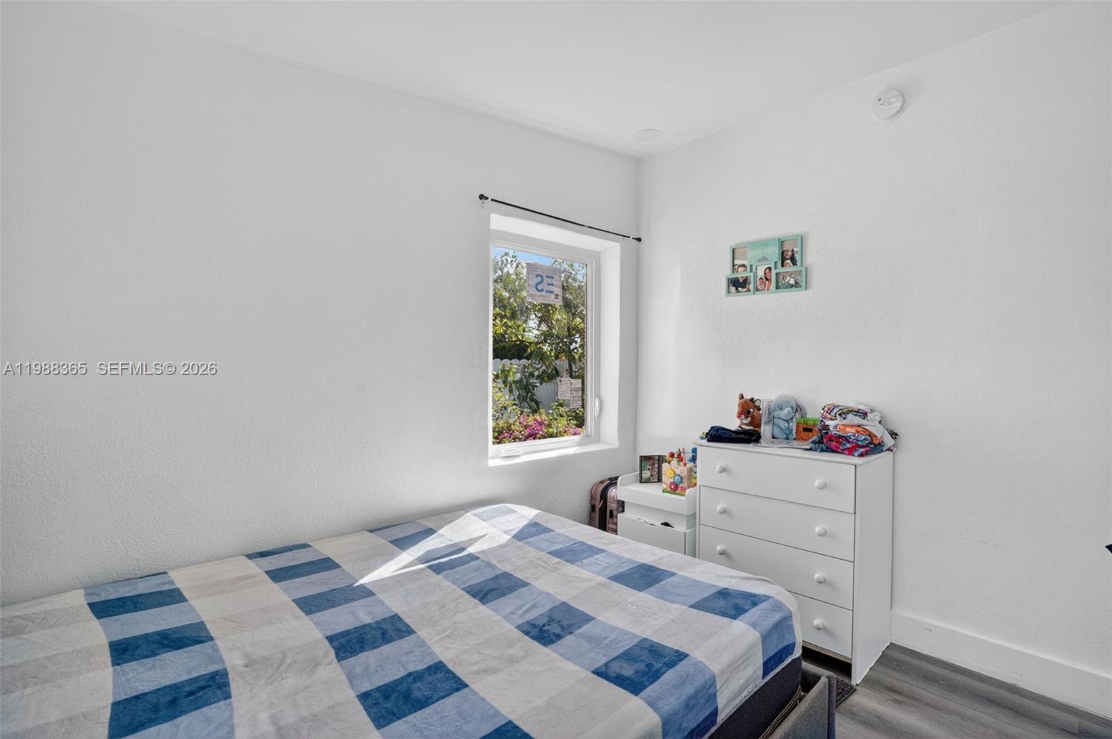 2001 Rutland Street Opa-Locka, FL 33054 - Photo 19 of 29 a bedroom with a bed and a window