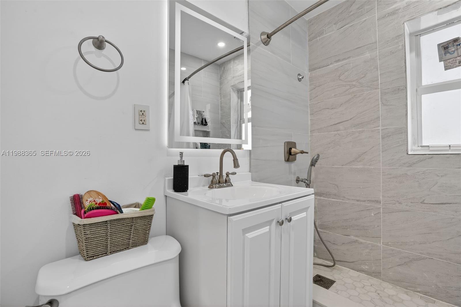 2001 Rutland Street Opa-Locka, FL 33054 - Photo 20 of 29 a bathroom with a sink a vanity and a shower