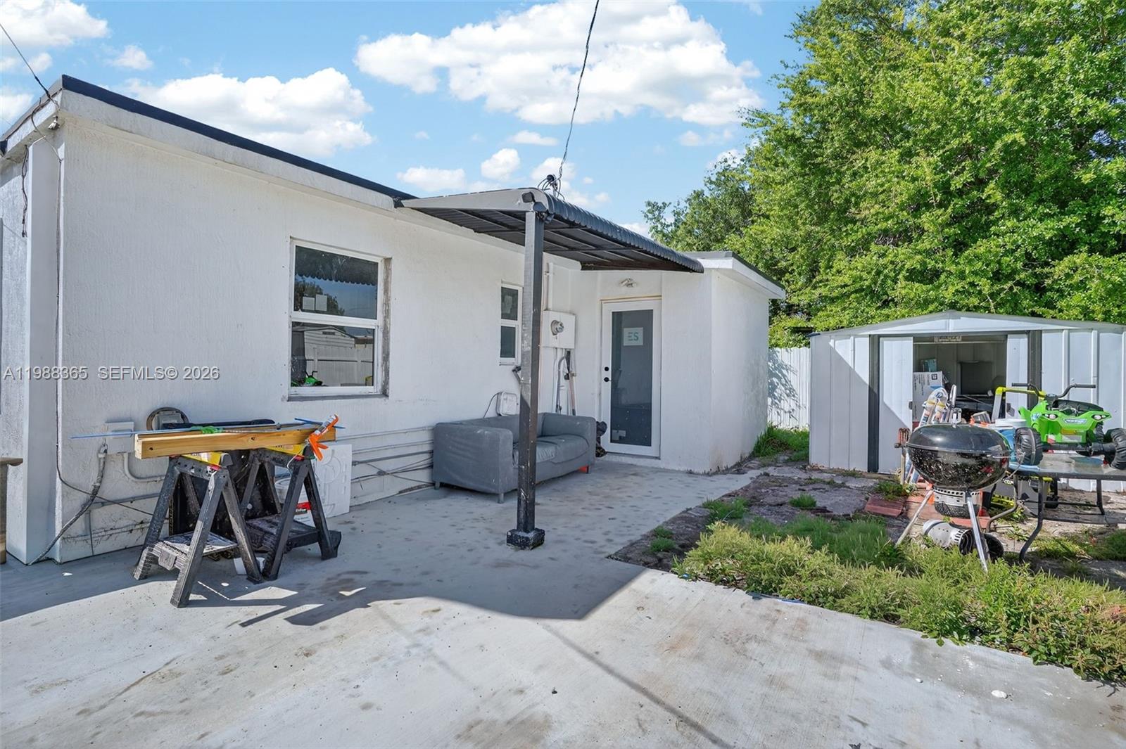 2001 Rutland Street Opa-Locka, FL 33054 - Photo 21 of 29 a view of backyard with outdoor seating and plants