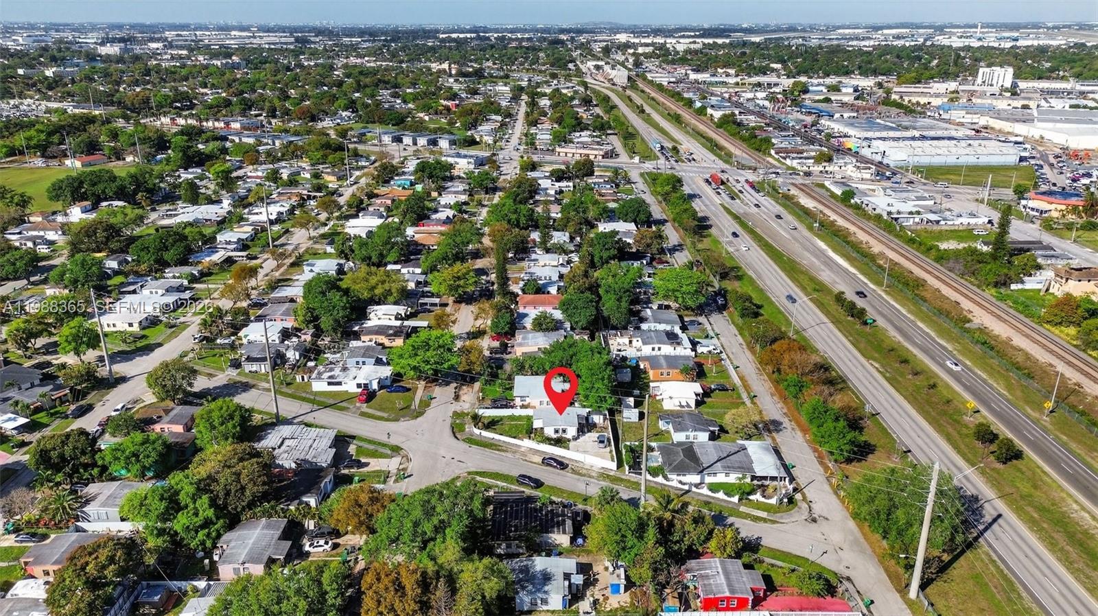 2001 Rutland Street Opa-Locka, FL 33054 - Photo 26 of 29 an aerial view of residential houses with outdoor space and trees