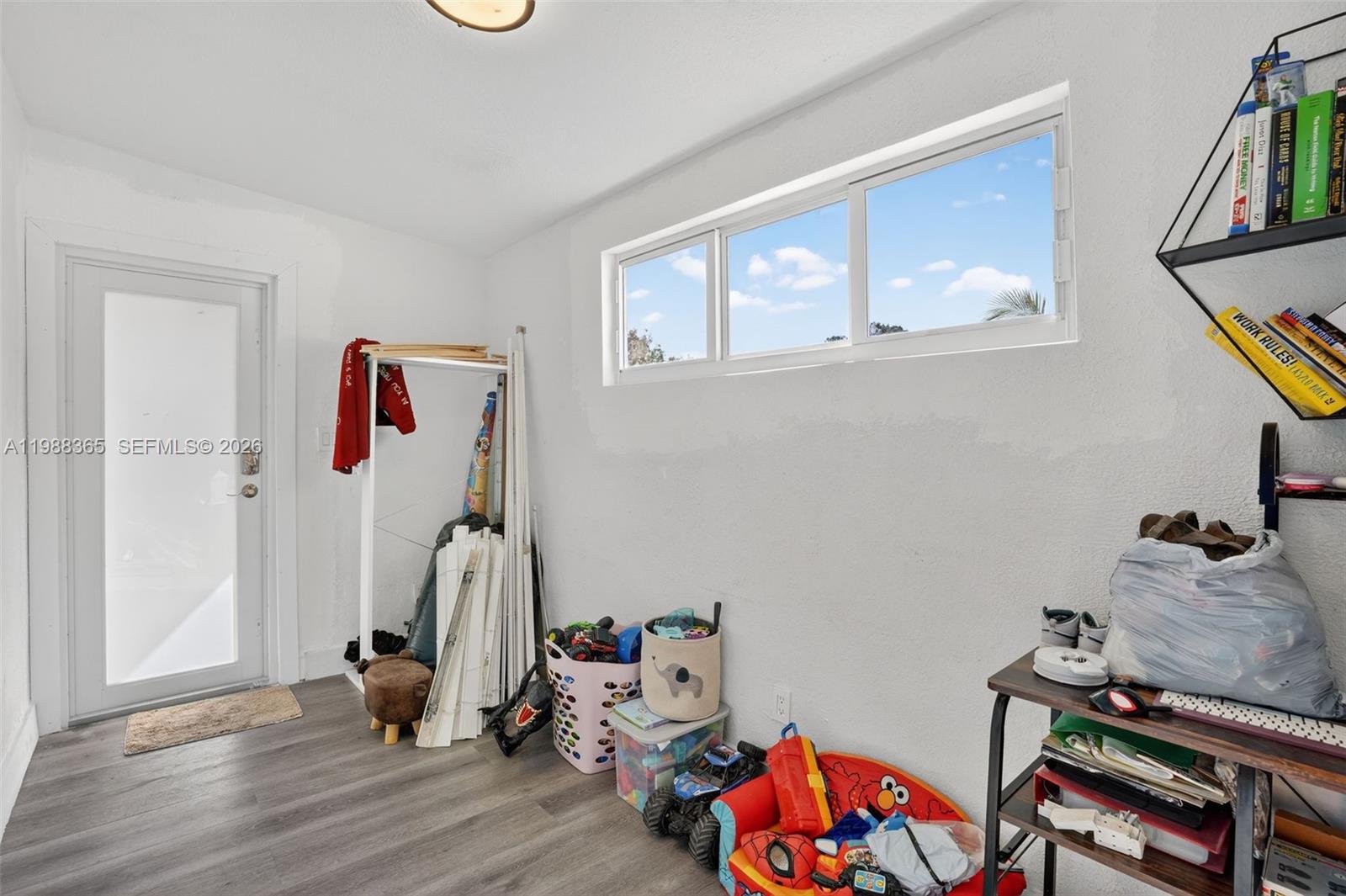 2001 Rutland Street Opa-Locka, FL 33054 - Photo 8 of 29 a bedroom with furniture and a window