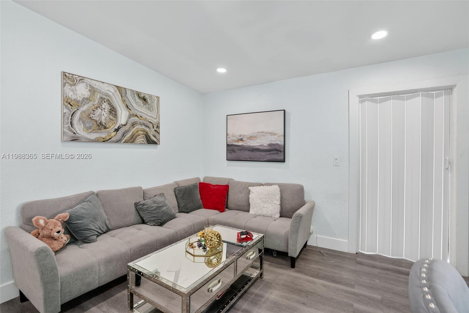 2001 Rutland Street Opa-Locka, FL 33054 - Photo 10 of 29 a living room with furniture and a wooden floor