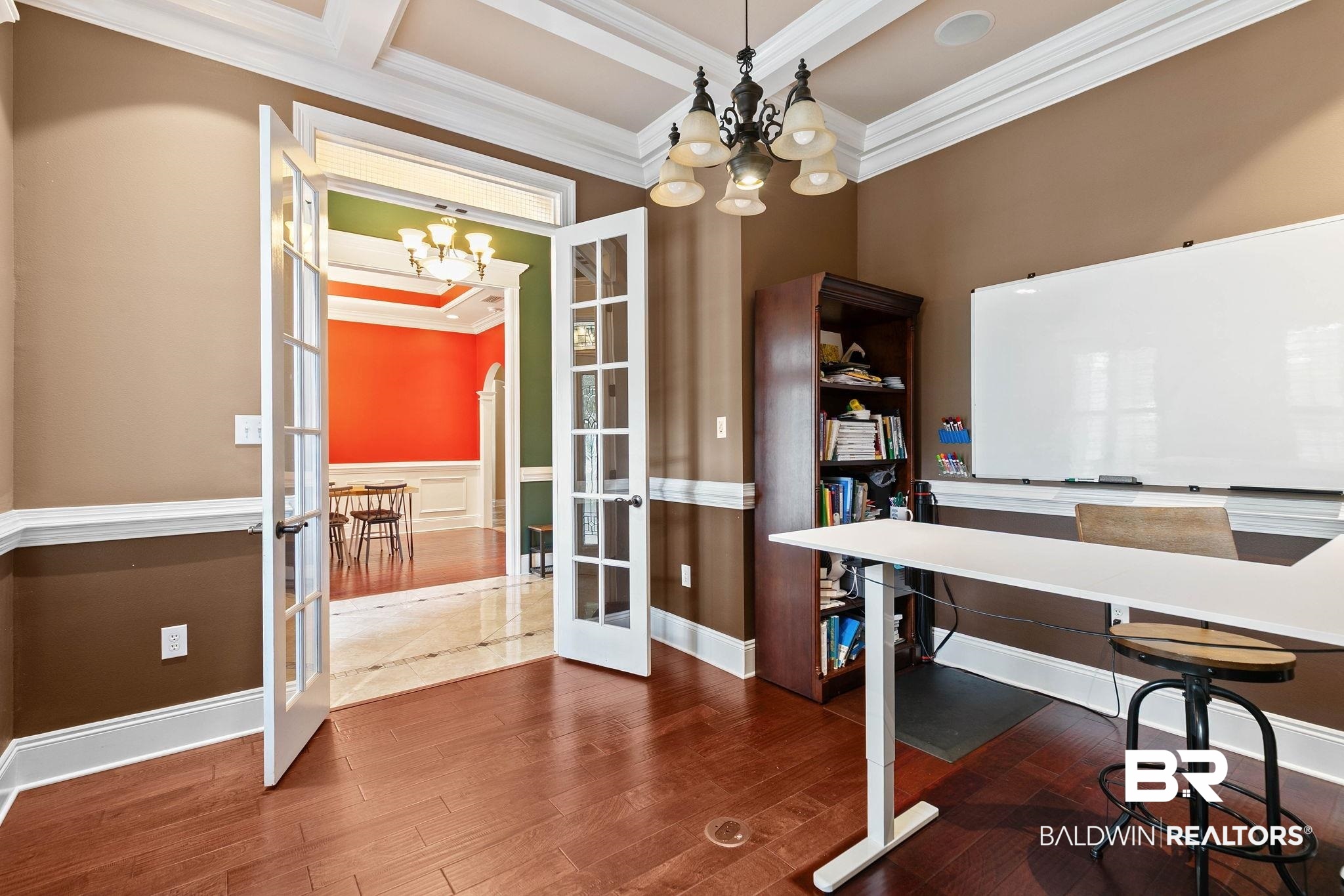 3668 Claridge Road North Mobile, AL 36608 - Photo 35 of 100 Office area featuring crown molding, hanging lights, french doors, dark wood-style floors, and wainscoting