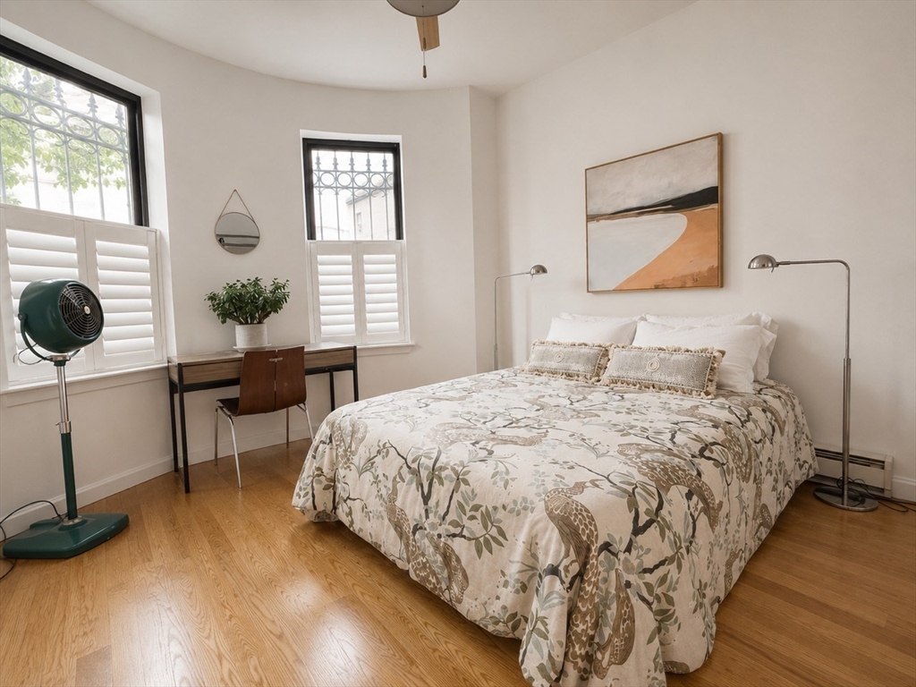 9 Albemarle Street, Unit 2 Boston, MA 02115 - Photo 3 of 11 a bedroom with a bed and a window