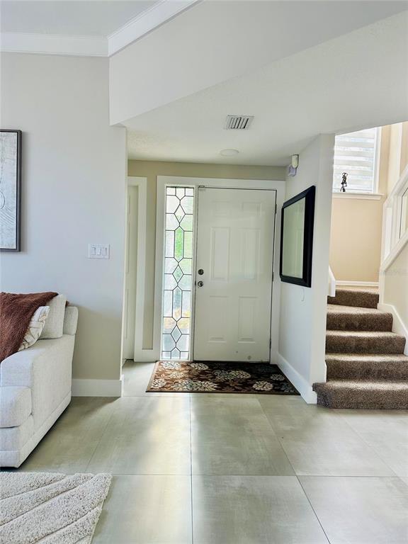 784 South Pennsylvania Avenue Winter Park, FL 32789 - Photo 2 of 29 a view of a livingroom with furniture and stairs