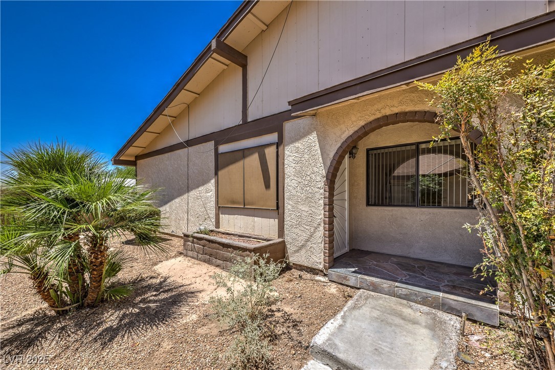 5829 Smoke Ranch Road, Unit C Las Vegas, NV 89108 - Photo 2 of 25 Property entrance featuring stucco siding
