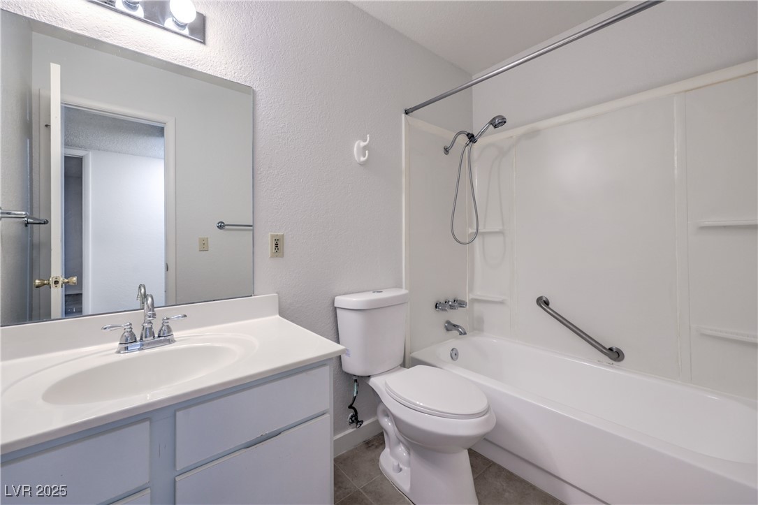 5829 Smoke Ranch Road, Unit C Las Vegas, NV 89108 - Photo 21 of 25 Bathroom featuring vanity, tile patterned floors,